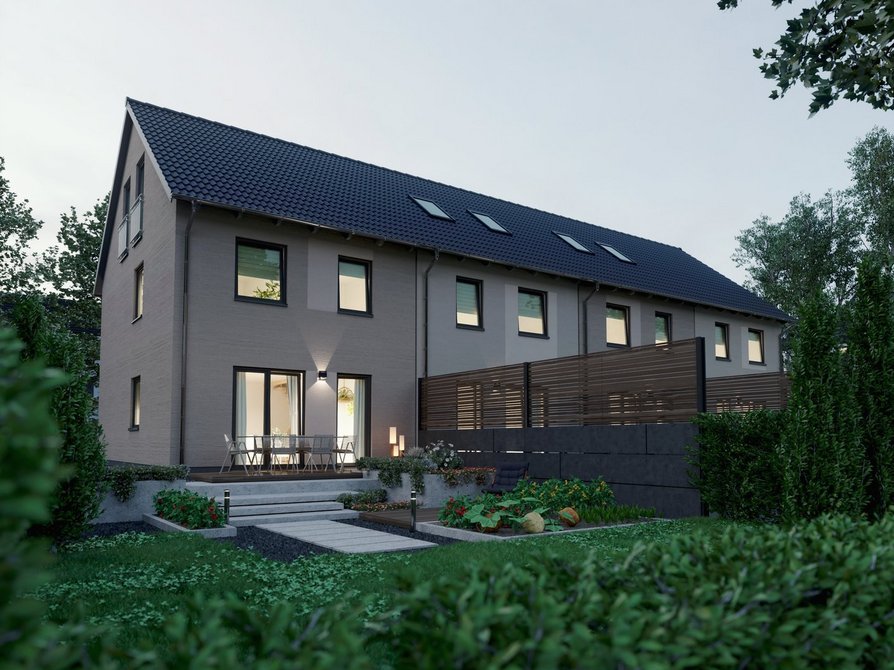 Neubau Reihenhaus Mainz 128 mit vier Wohneinheiten bei Abendlicht Gartenansicht mit beleuchteten Fenstern